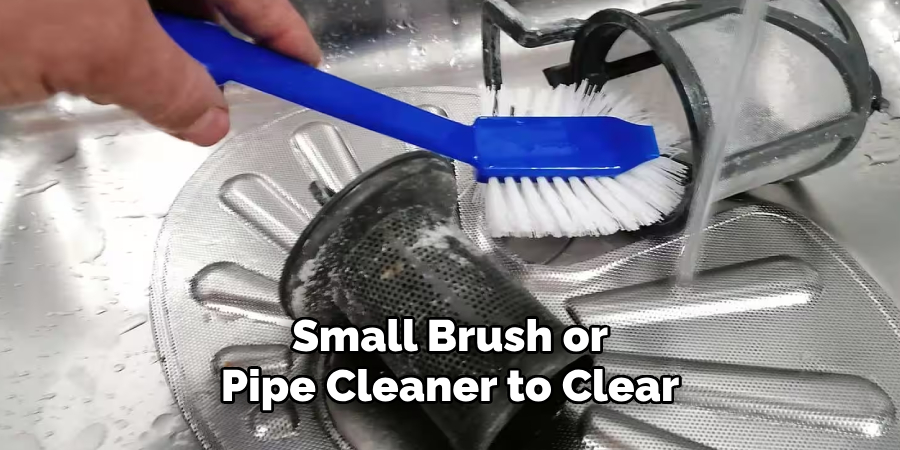 Small Brush or
Pipe Cleaner to Clear