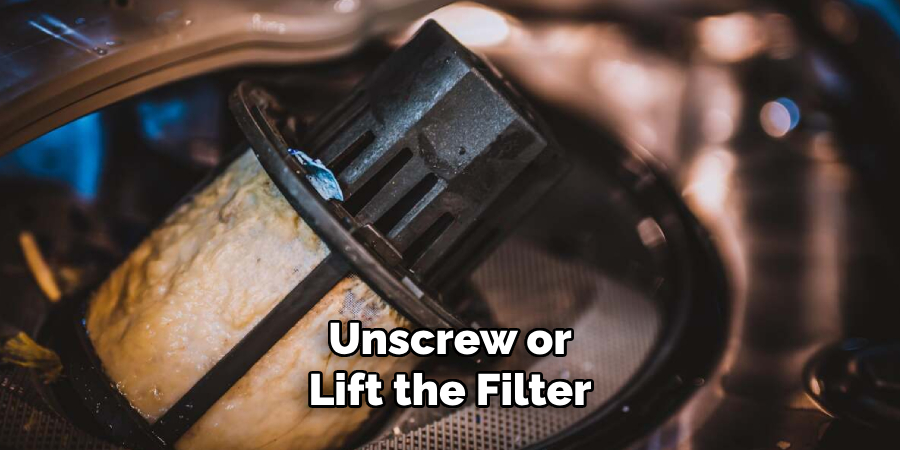 Unscrew or Lift the Filter