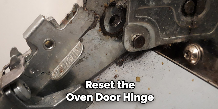 Reset the
Oven Door Hinge  