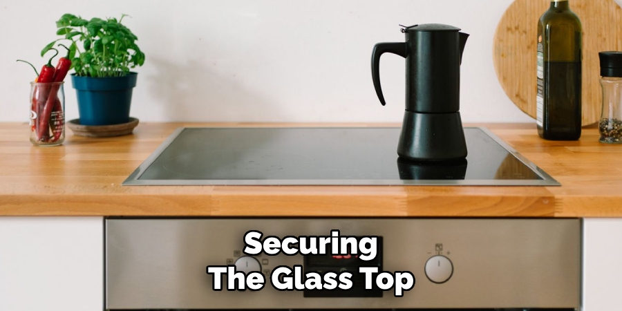 Securing
The Glass Top