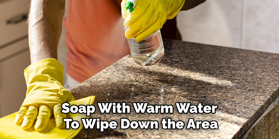 Soap With Warm Water
To Wipe Down the Area