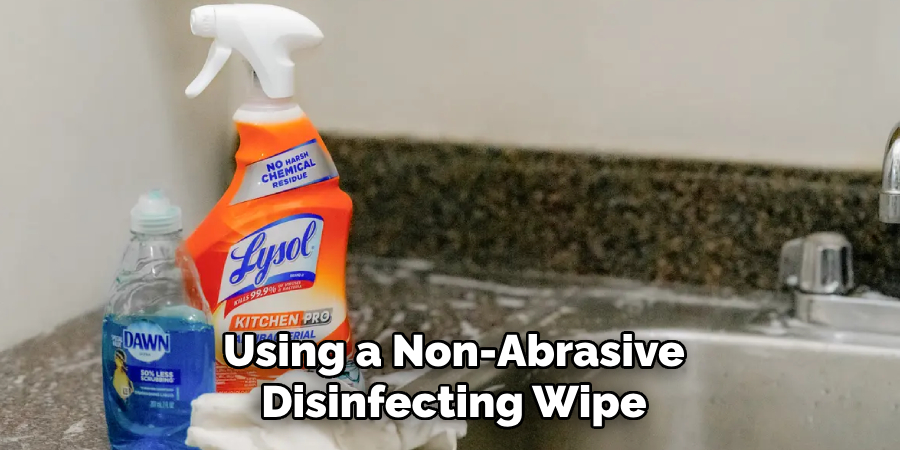 Using a Non-Abrasive Disinfecting Wipe