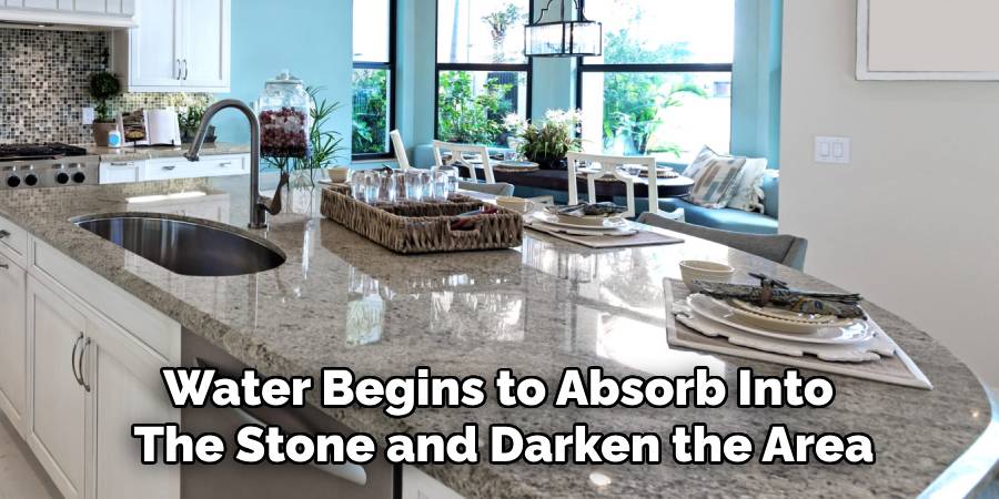 Water Begins to Absorb Into
The Stone and Darken the Area