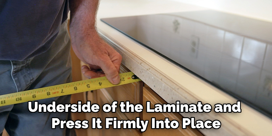 Underside of the Laminate and Press It Firmly Into Place